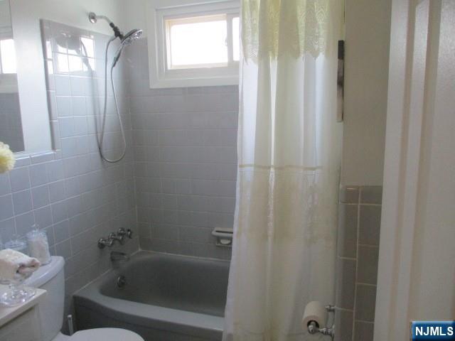 26 Donna Court Nutley, NJ 07110 - Photo 18 of 34 a bathroom with a tub and shower