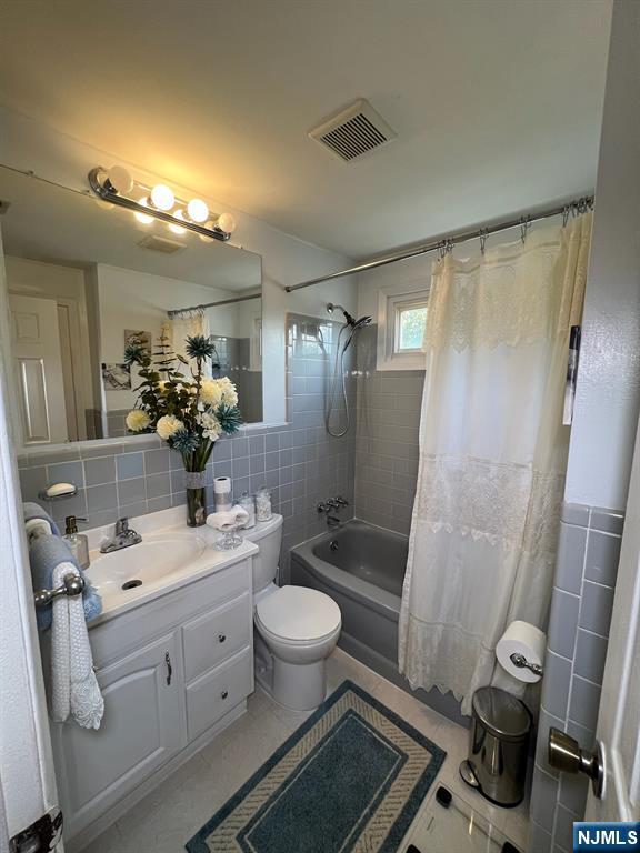 26 Donna Court Nutley, NJ 07110 - Photo 19 of 34 a bathroom with a double vanity sink mirror double and toilet