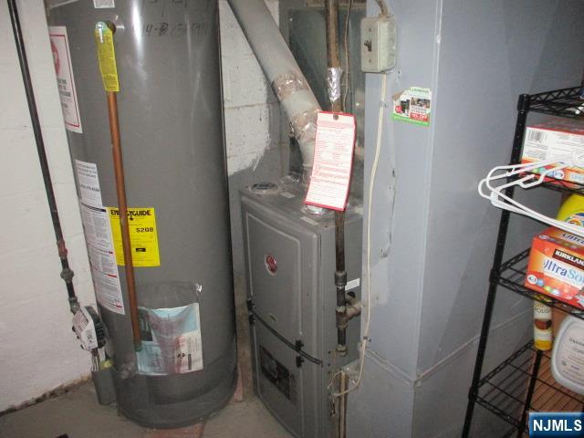 26 Donna Court Nutley, NJ 07110 - Photo 23 of 34 a room with wooden door and furniture