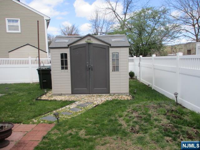 26 Donna Court Nutley, NJ 07110 - Photo 26 of 34 a backyard of a house with lots of green space