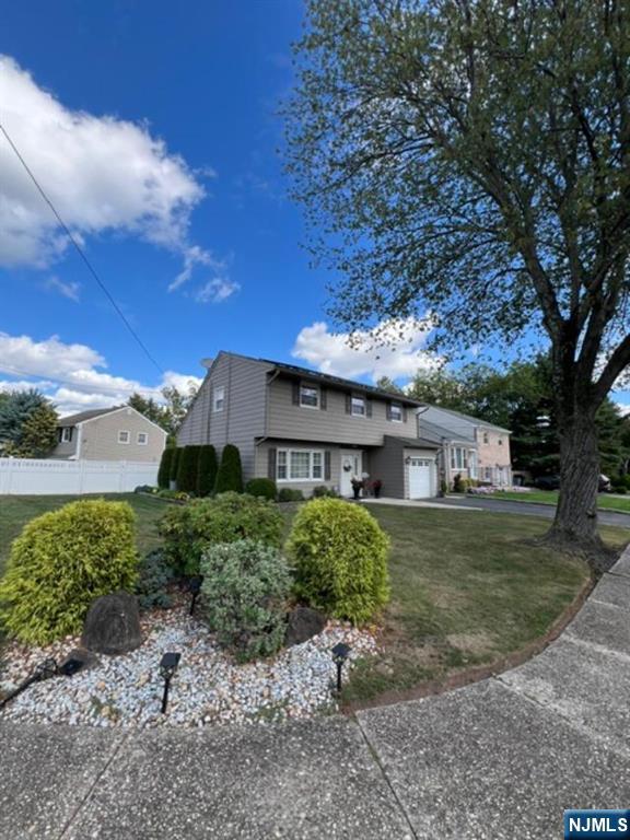 26 Donna Court Nutley, NJ 07110 - Photo 29 of 34 a front view of a house with a yard