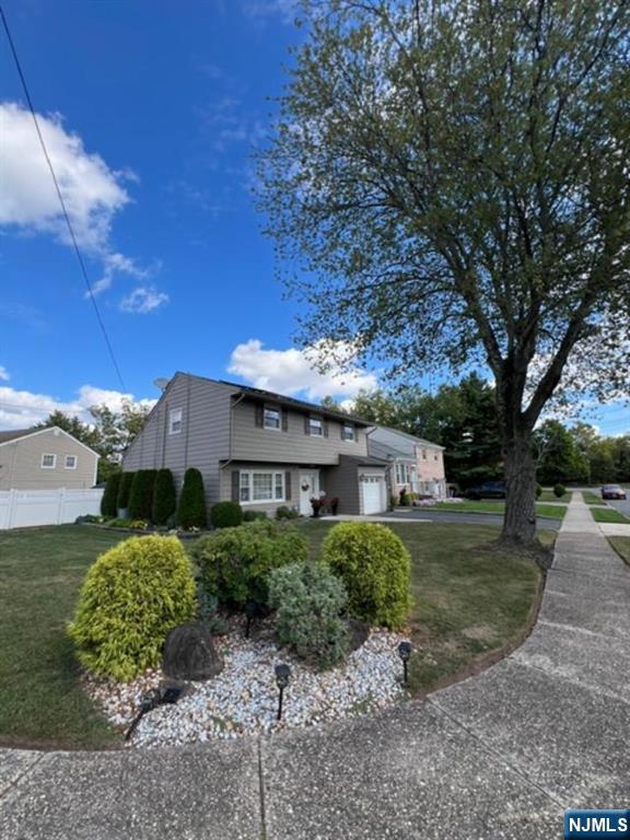 26 Donna Court Nutley, NJ 07110 - Photo 34 of 34 a front view of a house with garden