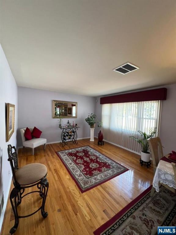 26 Donna Court Nutley, NJ 07110 - Photo 4 of 34 a living room with a couch and a table