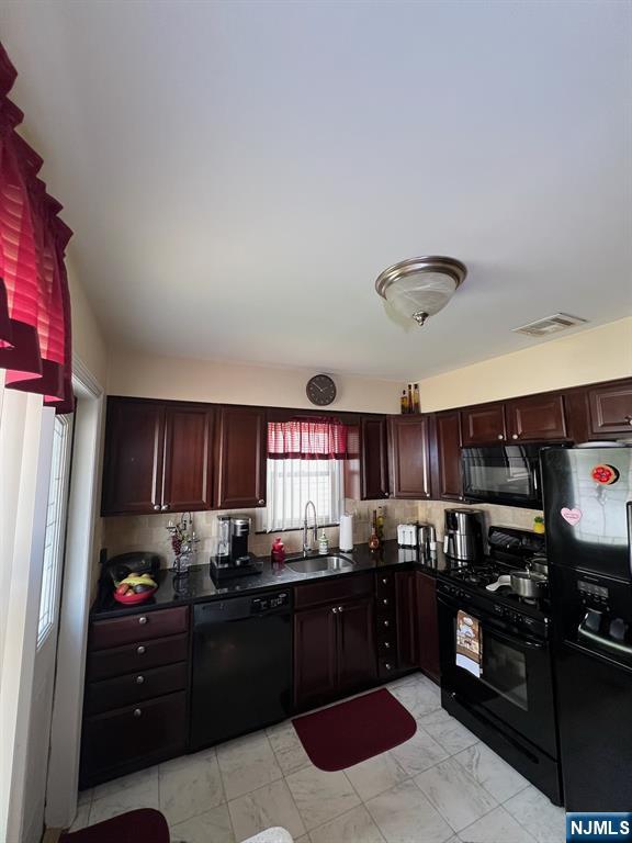 26 Donna Court Nutley, NJ 07110 - Photo 8 of 34 a kitchen with stainless steel appliances granite countertop a refrigerator and a stove top oven