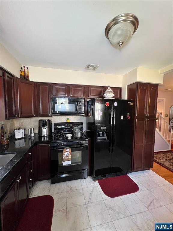 26 Donna Court Nutley, NJ 07110 - Photo 9 of 34 a kitchen with stainless steel appliances granite countertop a refrigerator and stove