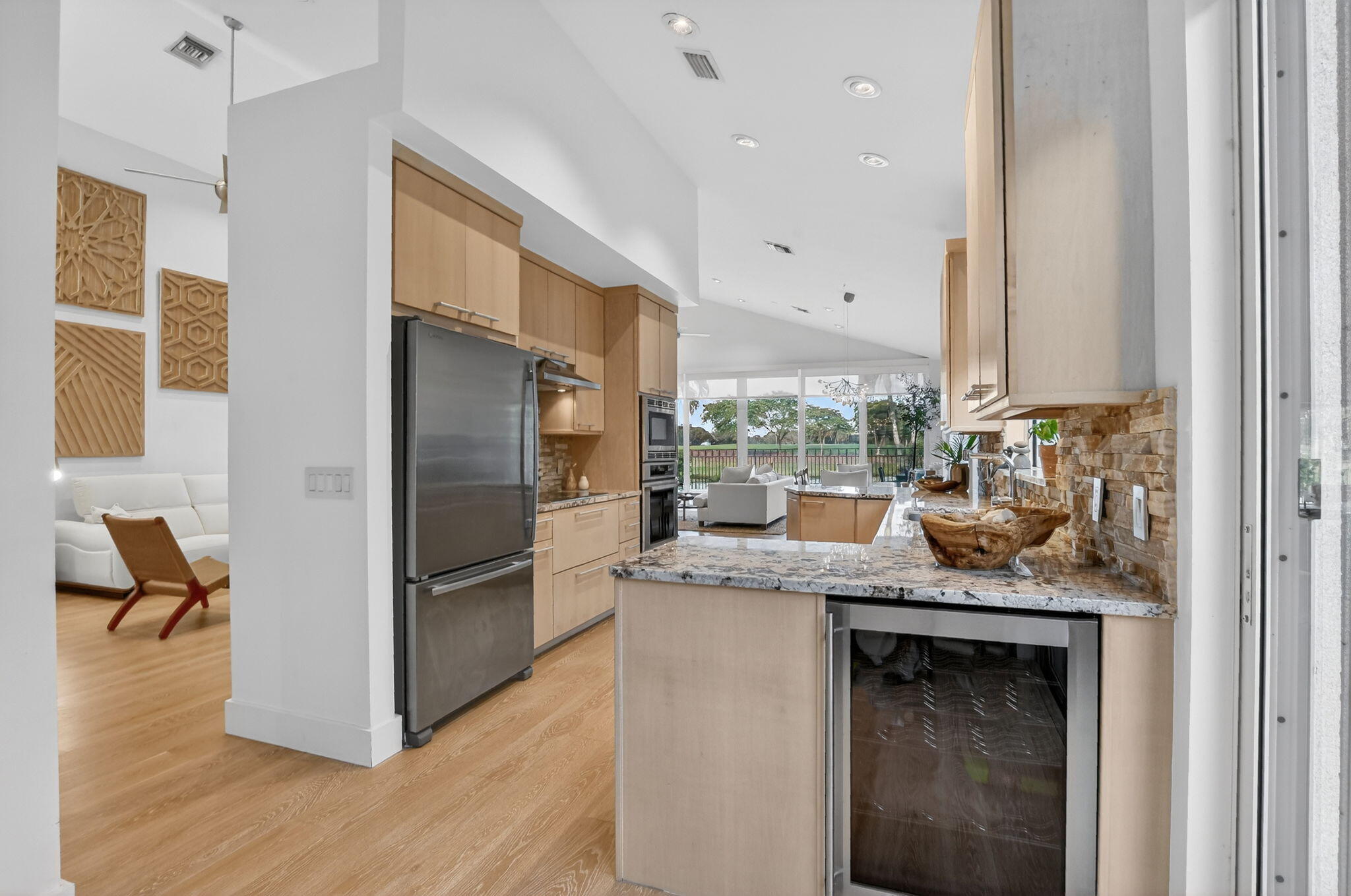 2051 Northwest 56th Street Boca Raton, FL 33496 - Photo 20 of 58 a kitchen with a refrigerator and a sink