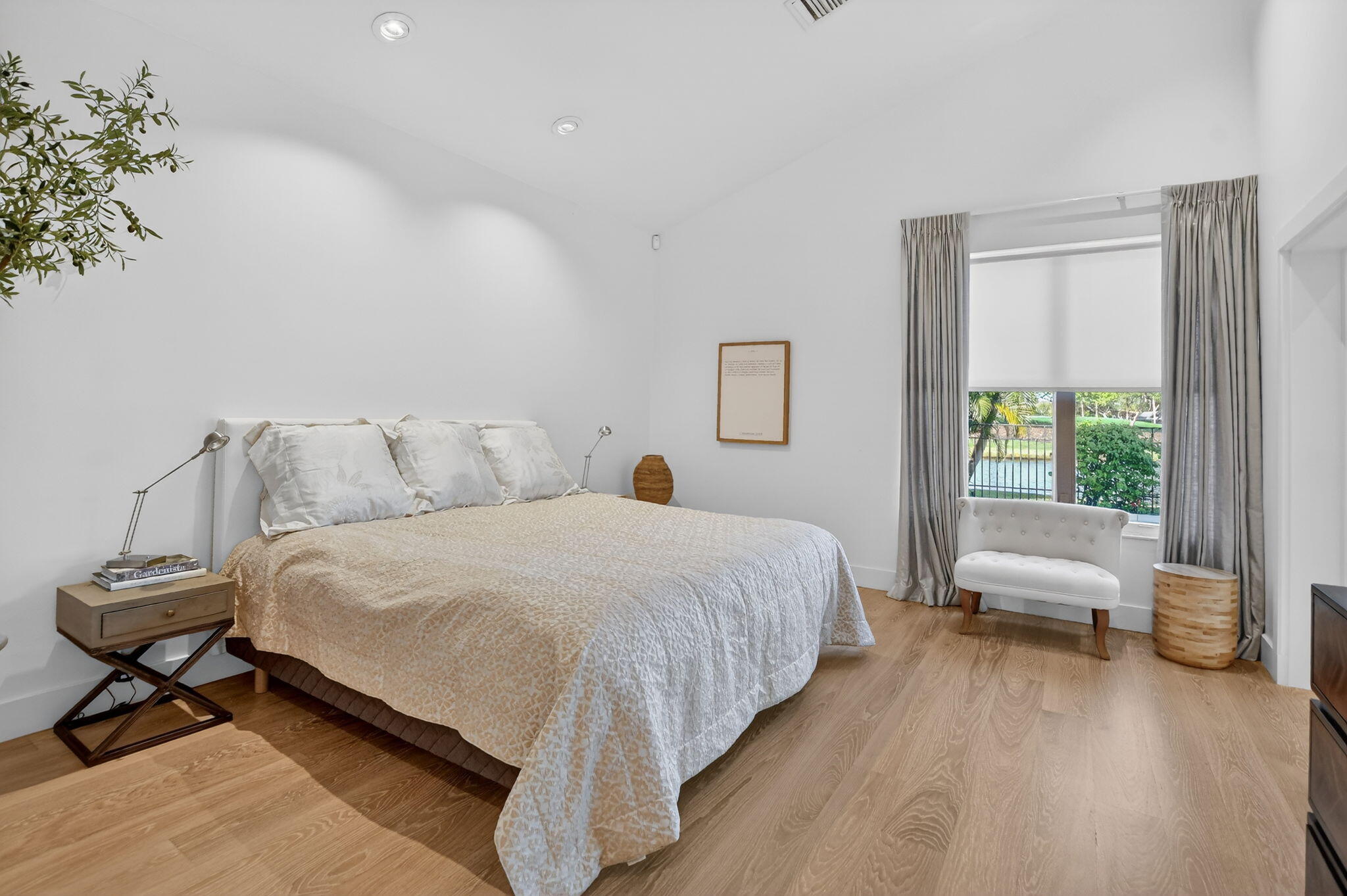 2051 Northwest 56th Street Boca Raton, FL 33496 - Photo 24 of 58 a bedroom with a bed and a large window