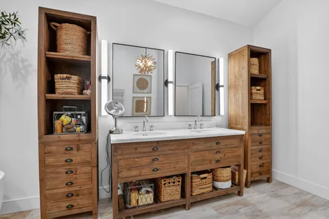 a bedroom with a bed and a tv on the dresser