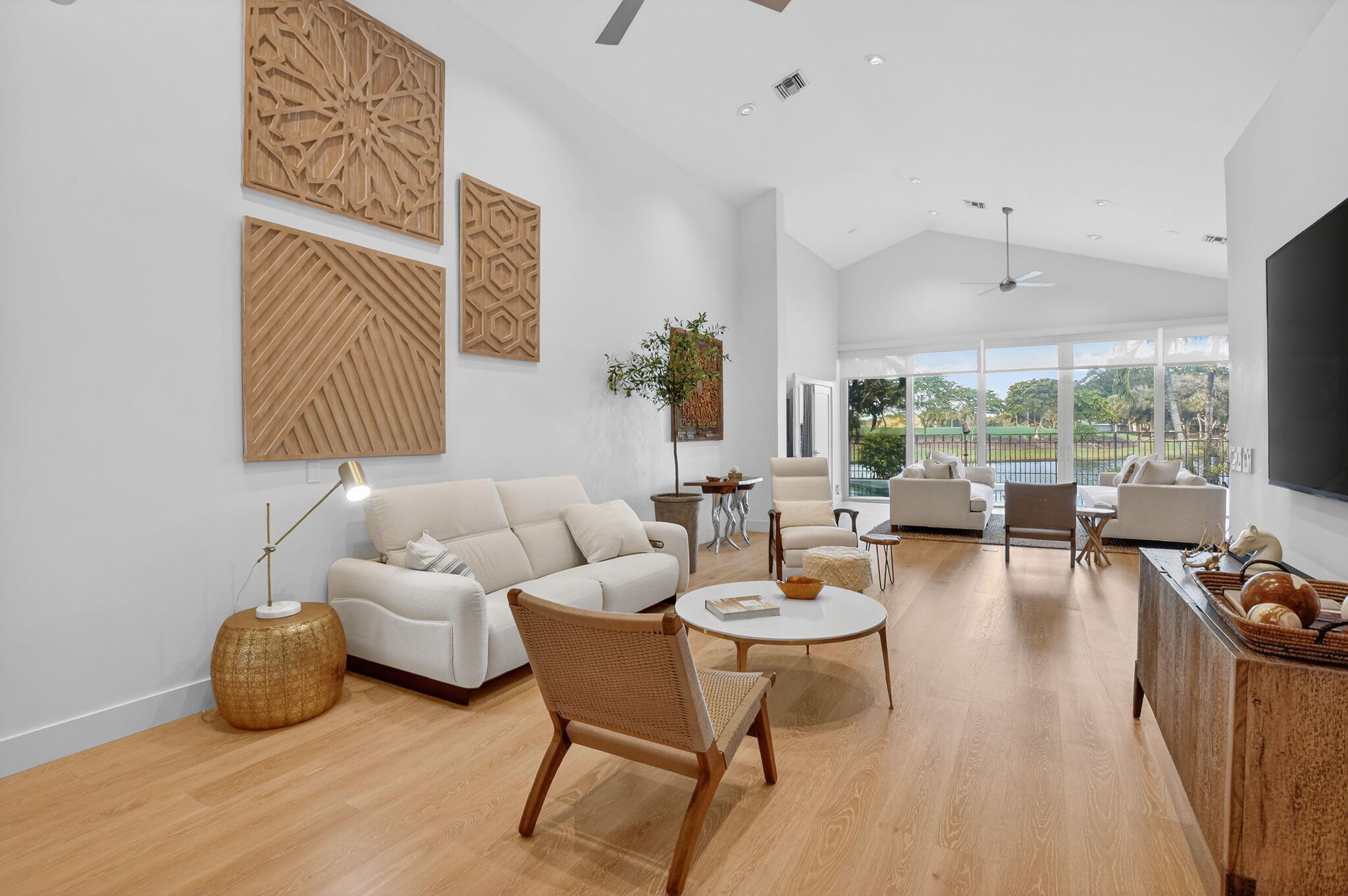 2051 Northwest 56th Street Boca Raton, FL 33496 - Photo 5 of 58 a living room with furniture and a large window