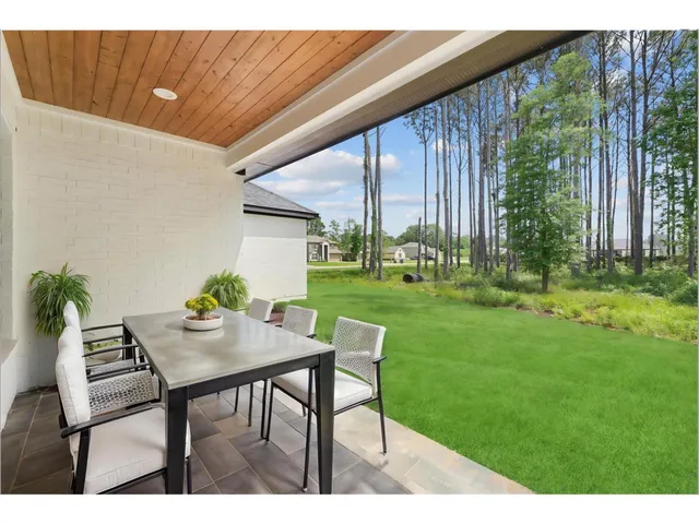 a view of yard with patio