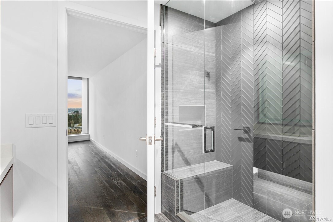 188 Bellevue Way Northeast, Unit 1907 Bellevue, WA 98004 - Photo 18 of 36 a bathroom with a toilet and shower