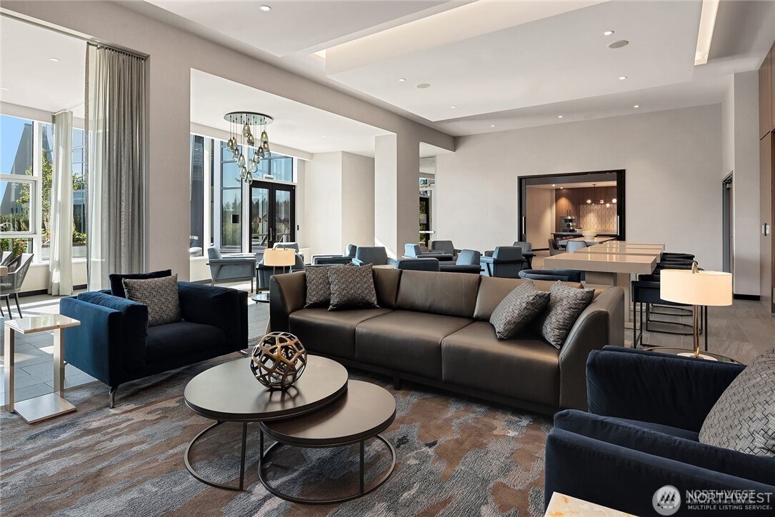 188 Bellevue Way Northeast, Unit 1907 Bellevue, WA 98004 - Photo 21 of 36 a living room with furniture and a potted plant