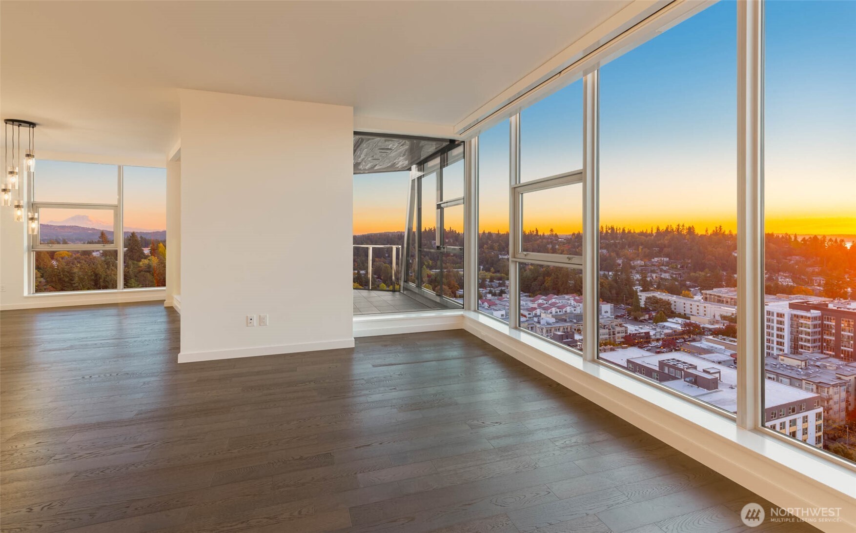 188 Bellevue Way Northeast, Unit 1907 Bellevue, WA 98004 - Photo 9 of 36 an empty room with wooden floor and windows