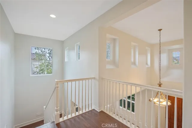 a view of a hallway with windows