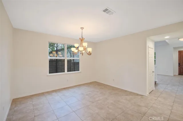 a view of empty room with windows