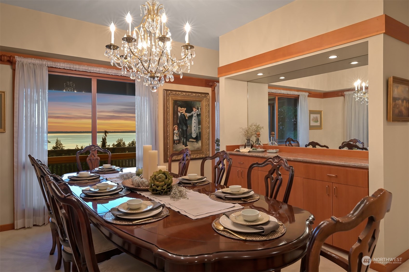 608 Clark Road Bellingham, WA 98225 - Photo 19 of 40 a view of a dining room with furniture a chandelier and large windows