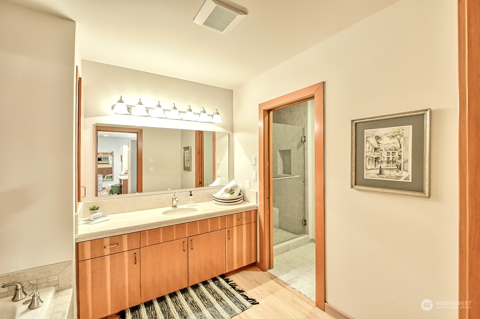 608 Clark Road Bellingham, WA 98225 - Photo 26 of 40 a spacious bathroom with a double vanity sink and a mirror