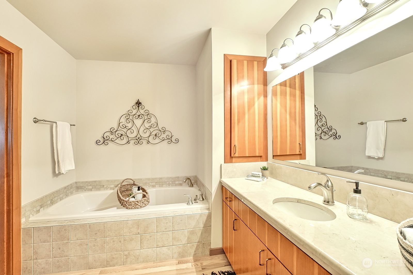 608 Clark Road Bellingham, WA 98225 - Photo 27 of 40 a bathroom with a tub sink and mirror
