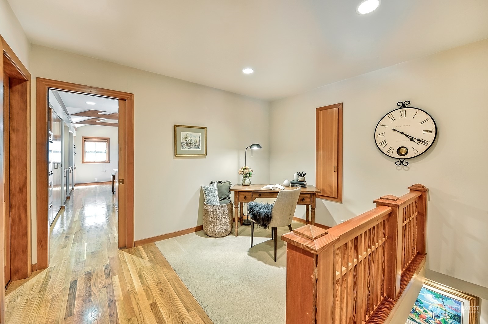 608 Clark Road Bellingham, WA 98225 - Photo 29 of 40 a living room with furniture a wooden floor and a clock