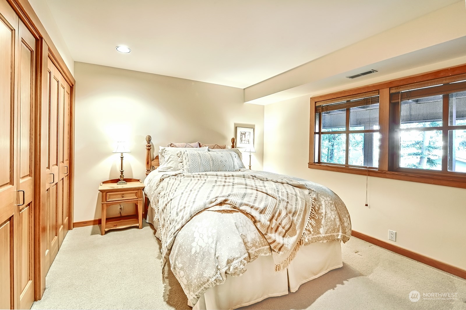 608 Clark Road Bellingham, WA 98225 - Photo 33 of 40 a bedroom with a bed and wooden floor