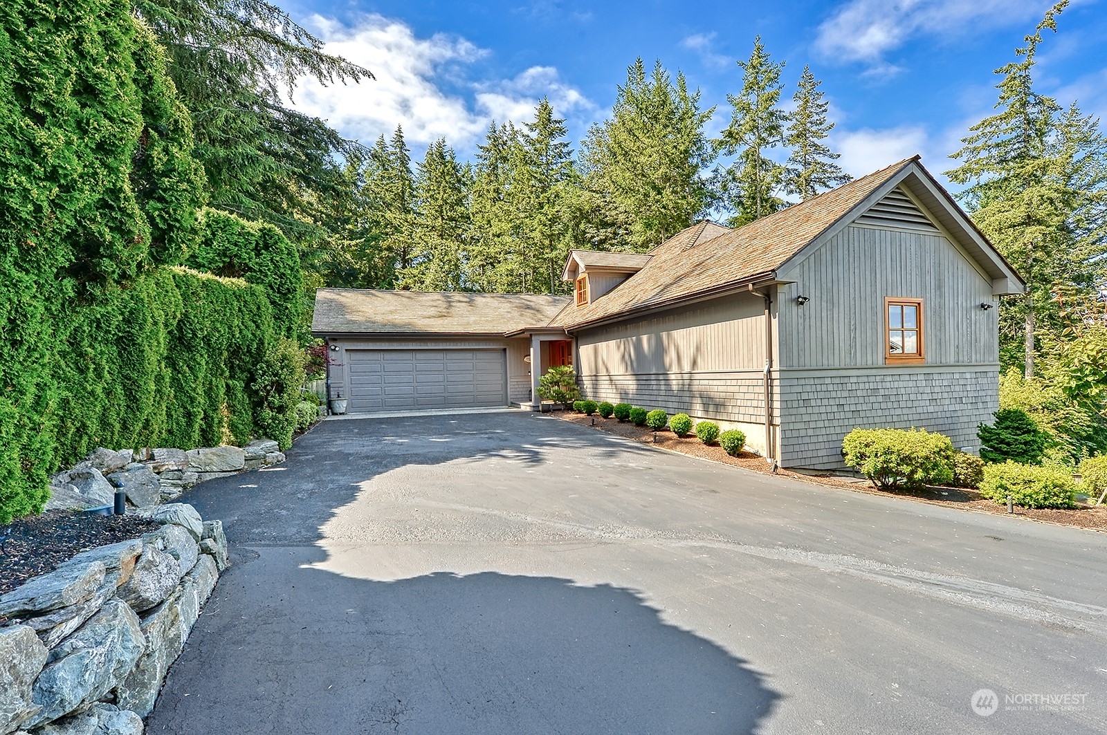 608 Clark Road Bellingham, WA 98225 - Photo 8 of 40 a front view of a house with a yard and garage