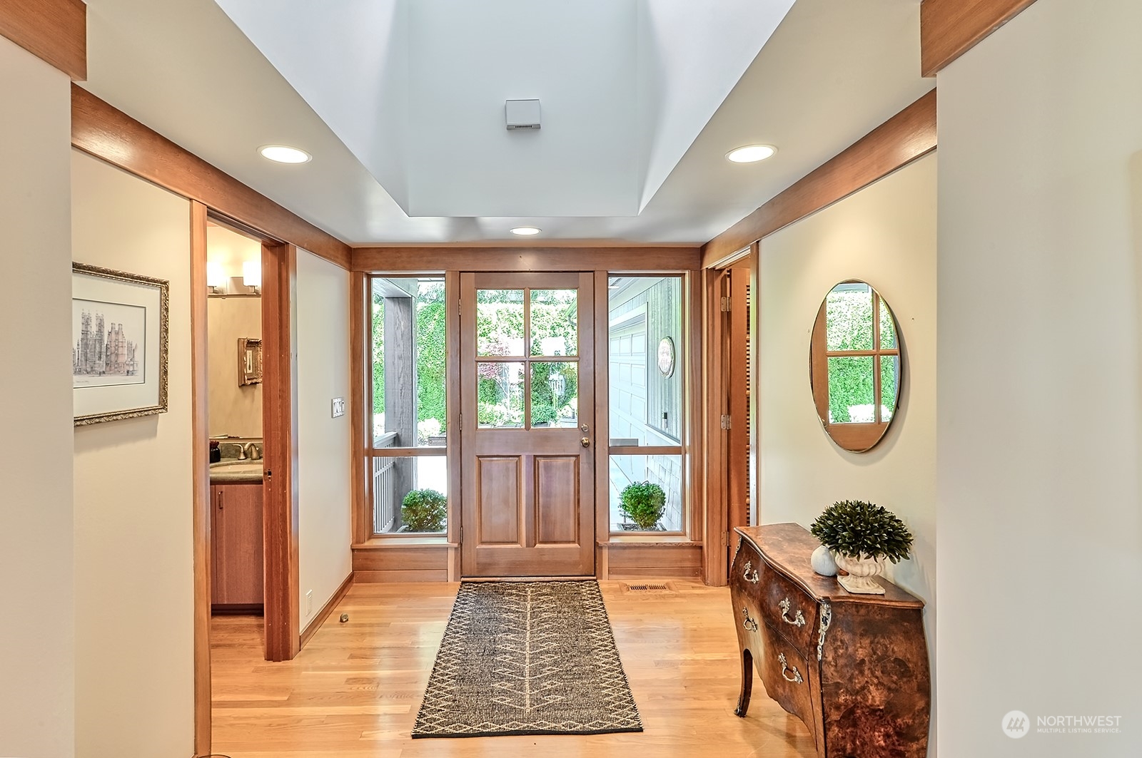 608 Clark Road Bellingham, WA 98225 - Photo 10 of 40 a hallway with sliding door and wooden floor