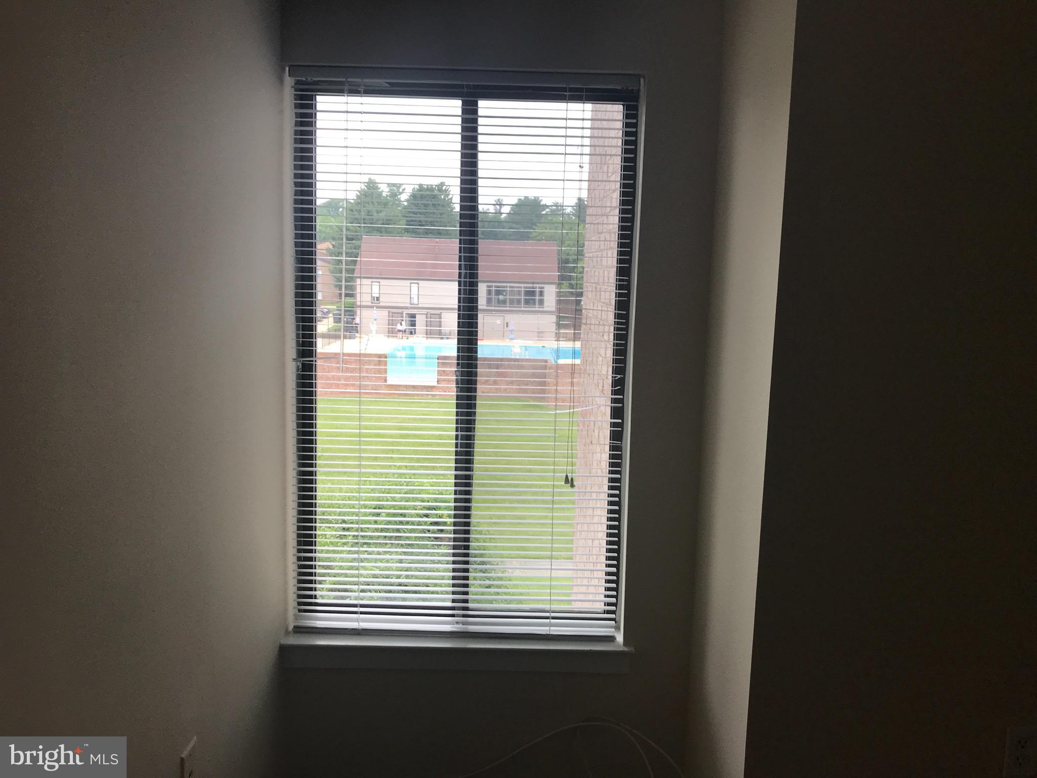 10028 Stedwick Road, Unit 202 Montgomery Village, MD 20886 - Photo 11 of 15 a view of an outdoor space with windows
