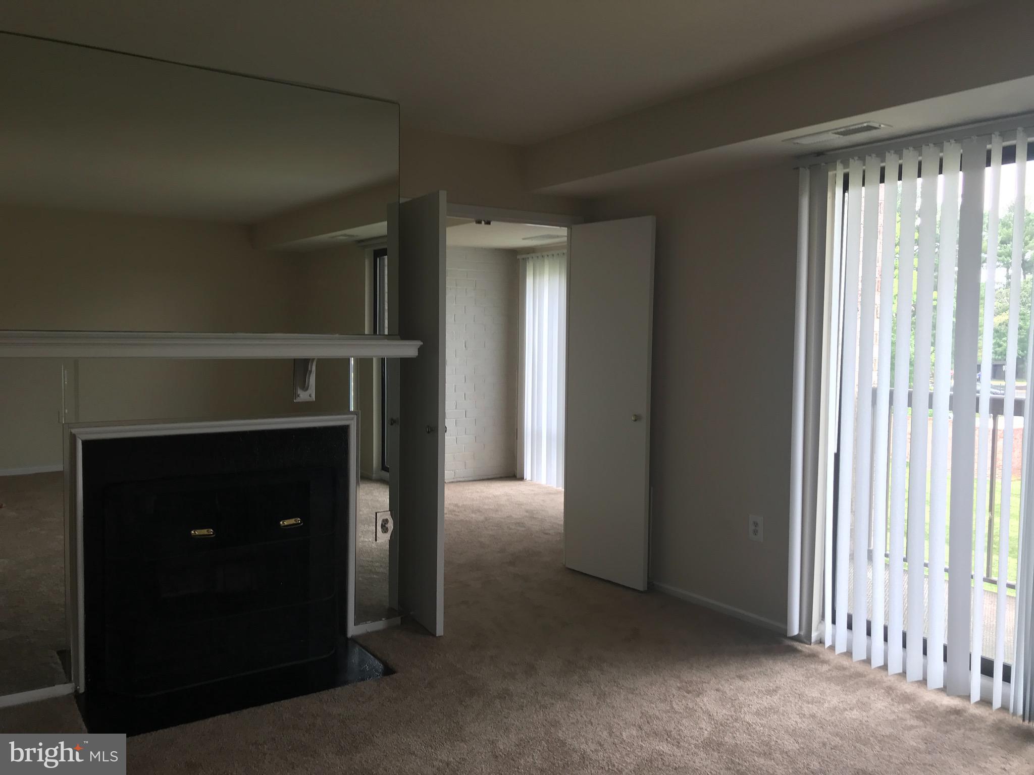 10028 Stedwick Road, Unit 202 Montgomery Village, MD 20886 - Photo 7 of 15 a view of livingroom with workspace