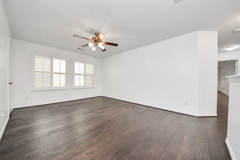 4222 Drake Street Houston, TX 77005 - Photo 16 of 28 an empty room with wooden floor and window