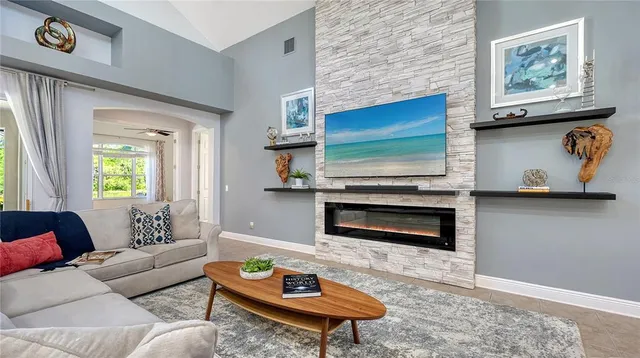 a living room with furniture and a large window