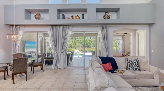 a kitchen with granite countertop white cabinets and stainless steel appliances