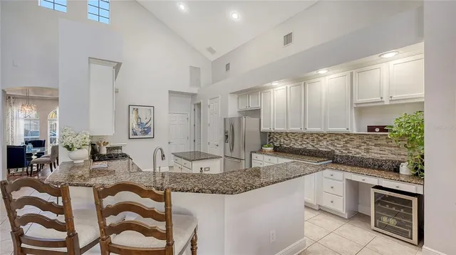 a bathroom with a double vanity sink a mirror and a bathtub