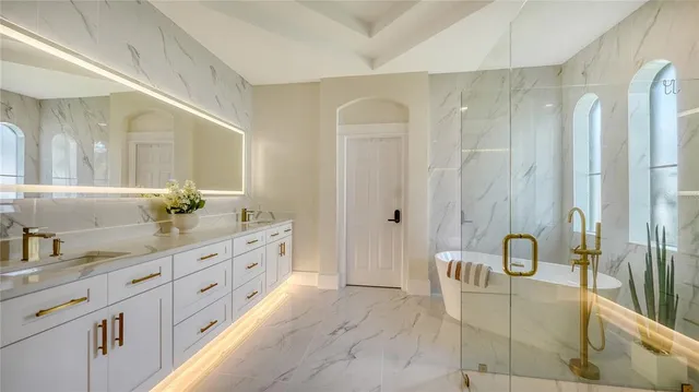 a view of a house with a yard and potted plants