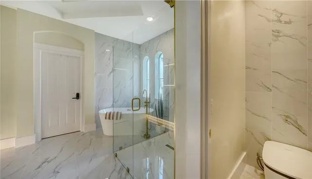 a view of a lake with houses in the back