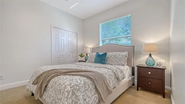 a view of a house with a porch and furniture
