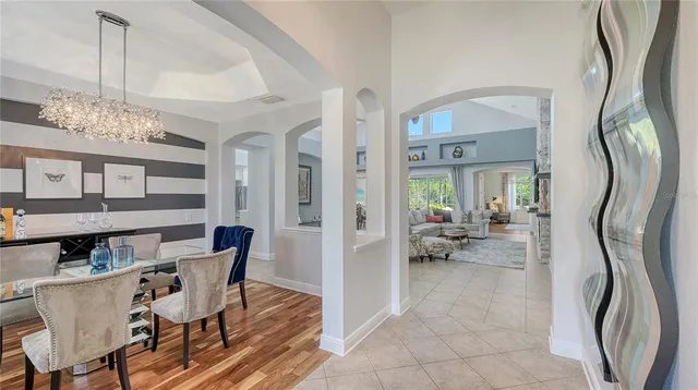 a view of a livingroom with furniture and a bookshelf