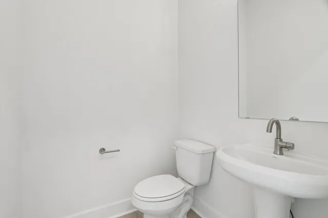 a bathroom with a sink and mirror