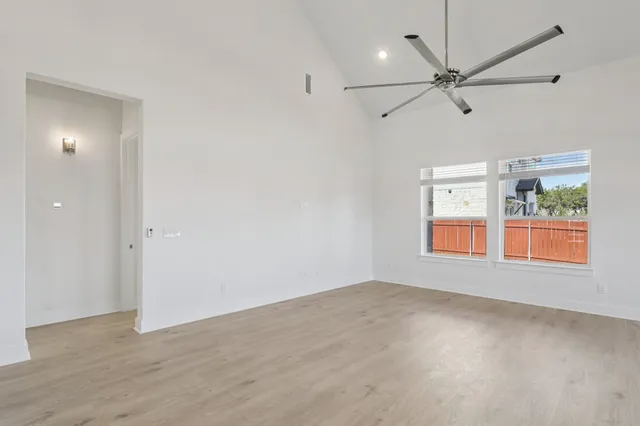 a view of a kitchen with a sink cabinet and a window