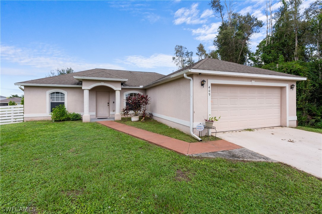 409 Paddock Street Lehigh Acres, FL 33974 - Photo 1 of 27 Gallery Image 1