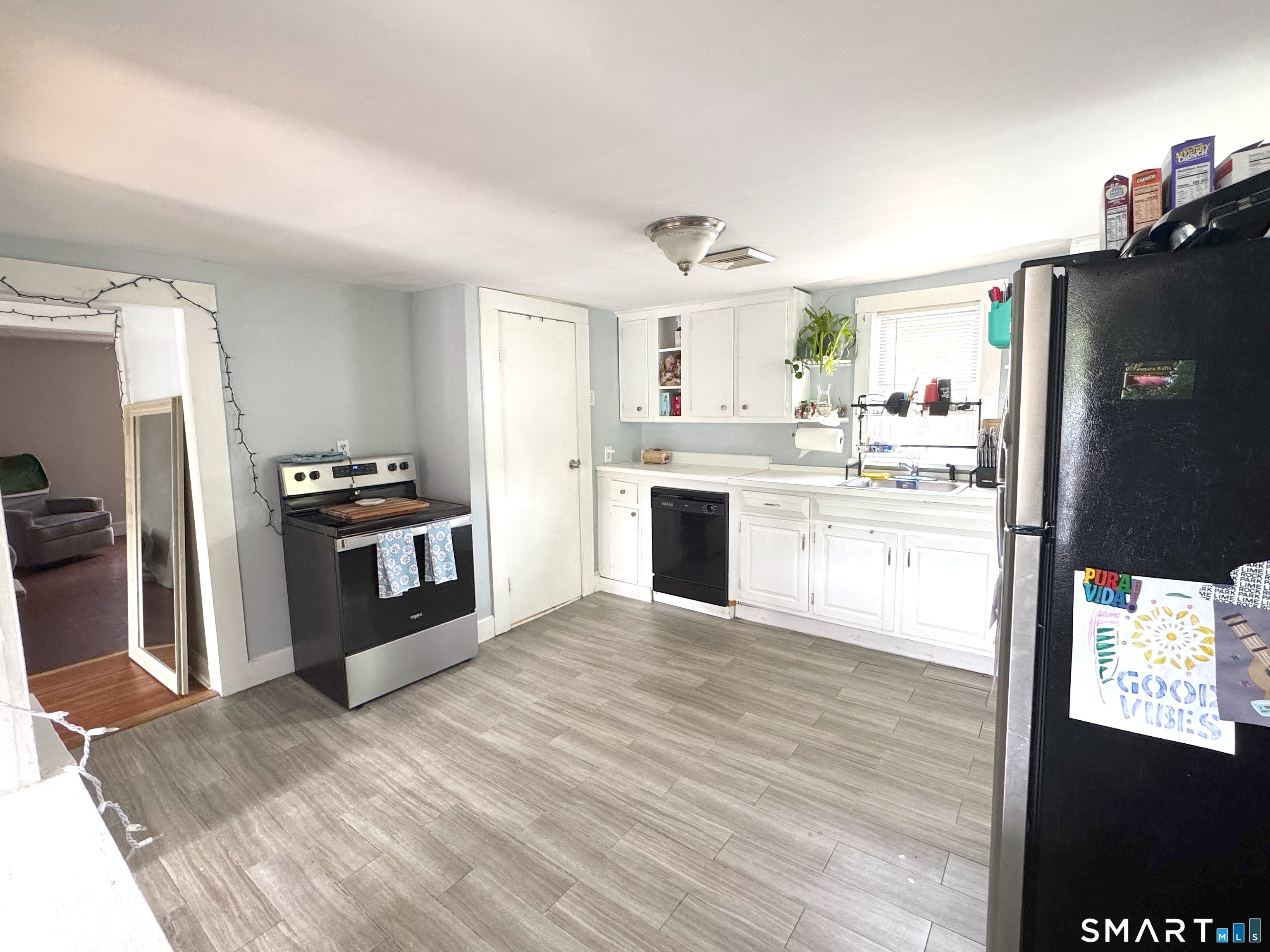 6-8 Vose Street Ansonia, CT 06401 - Photo 25 of 37 2nd floor kitchen and hallway leading into living room