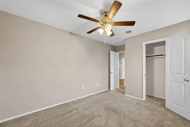 a view of empty room with windows