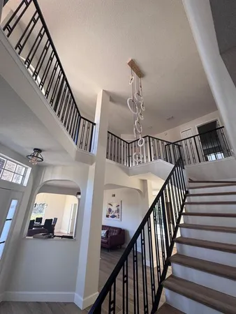 a utility room with cabinets washer and dryer