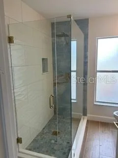 a bathroom with a sink mirror and vanity