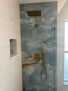 a bathroom with a bathtub and shower