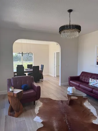 a view of a livingroom with wooden floor