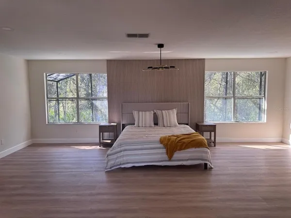 a kitchen with stainless steel appliances granite countertop a granite counter tops and a black refrigerator