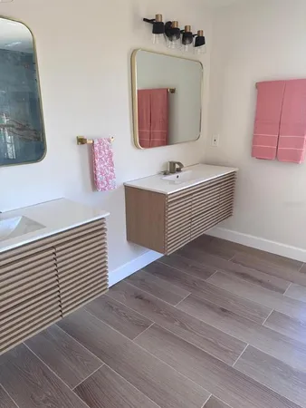 a view of a room with wooden floor