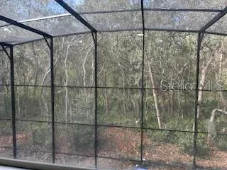 a view of staircase with wooden floor and a chandelier