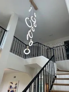 a large kitchen with stainless steel appliances granite countertop a stove a sink and a refrigerator