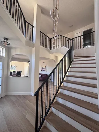 a kitchen with white cabinets and appliances